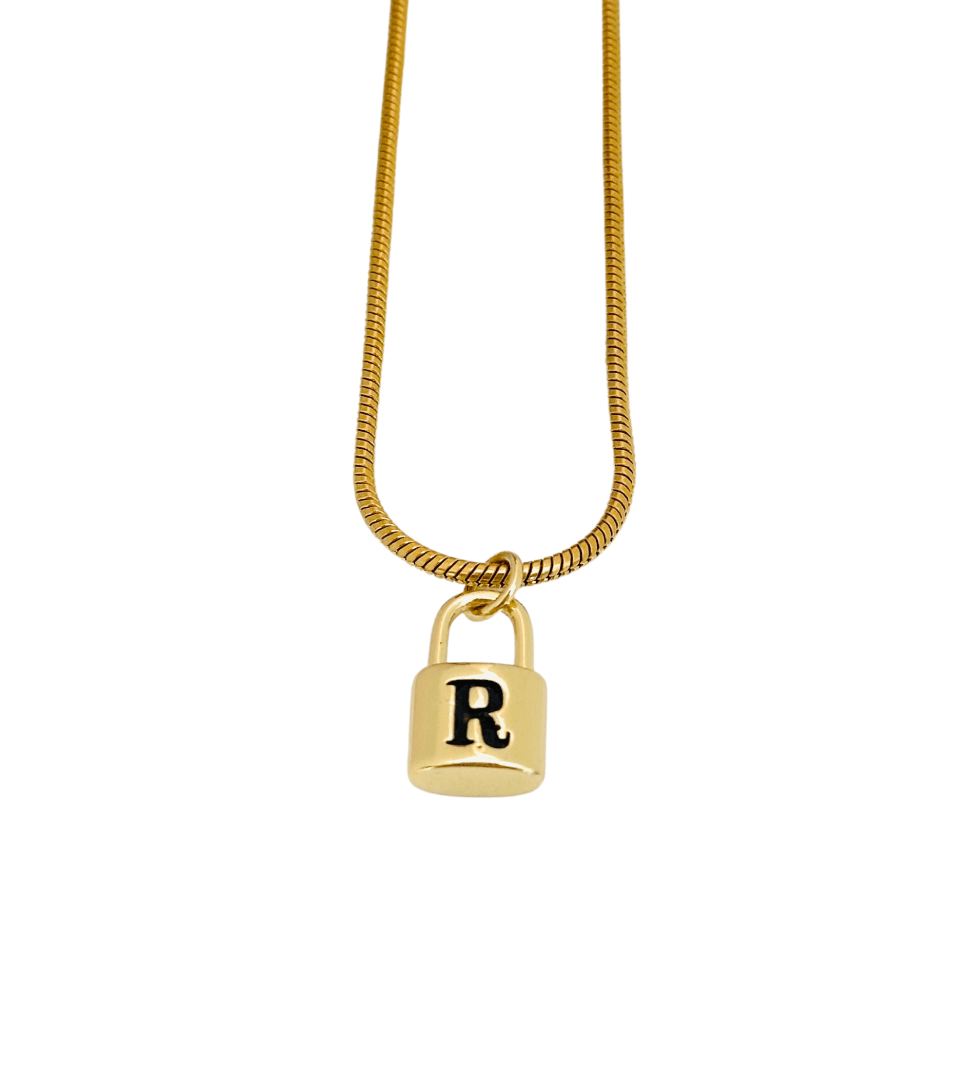 The Lock Initial Necklace is a gold necklace featuring a lock-shaped pendant with the letter 'R' in black, beautifully suspended from a snake chain. This elegant piece adds a personal touch to your style.