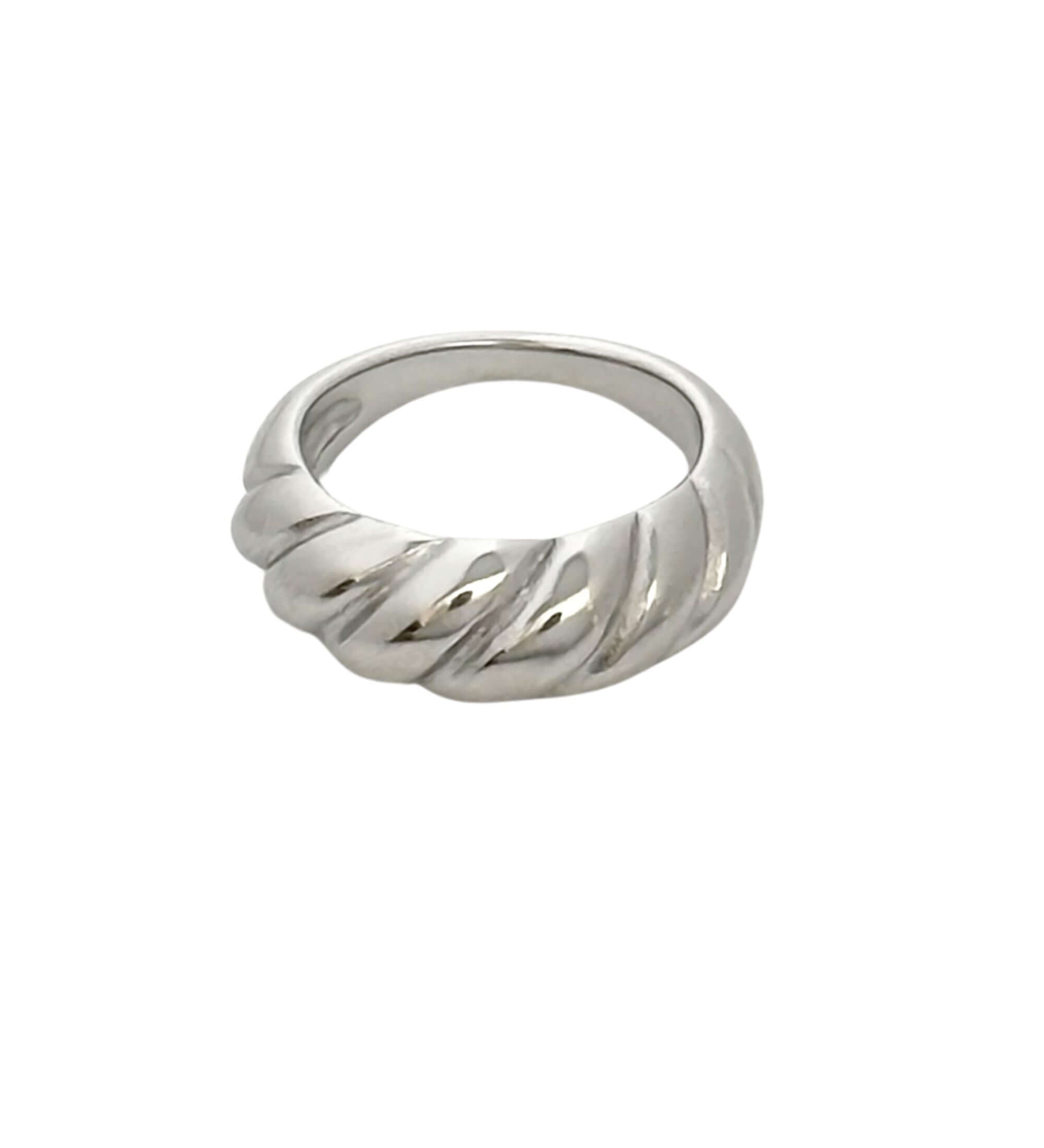 A Croissant Ring in silver, showcasing a twisted, rope-like design and a bold silhouette.