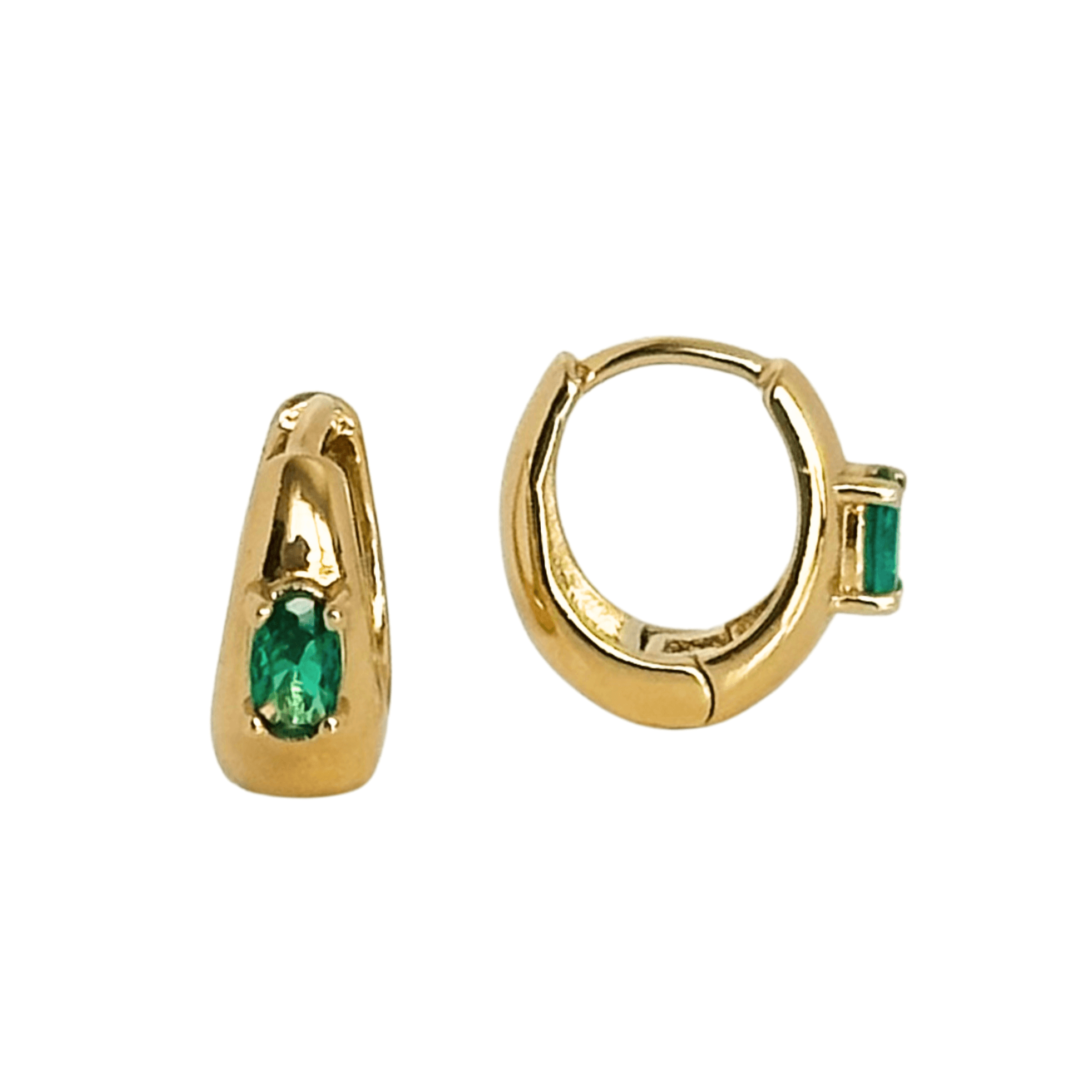 The Envy Emerald Hoops are gold hoop earrings, each featuring a small, oval emerald set in their design, offering the perfect huggie size for comfortable elegance.